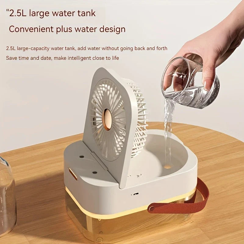 Desk Cooler Fan - White portable fan with lid open, a hand pouring water into its top fill reservoir.