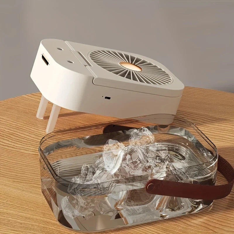 Desk Cooler Fan - White folded fan unit resting above its detached transparent water tank filled with ice cubes and water.