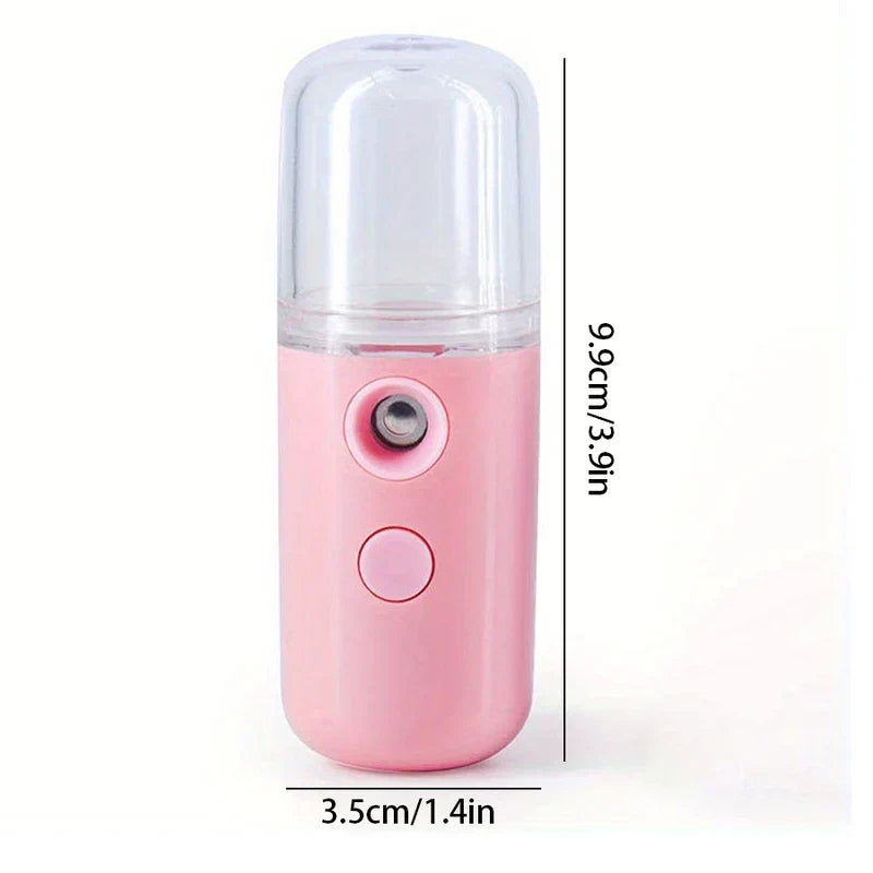 Pink USB nano facial mister with transparent top, height 9.9cm/3.9in, width 3.5cm/1.4in on white background.