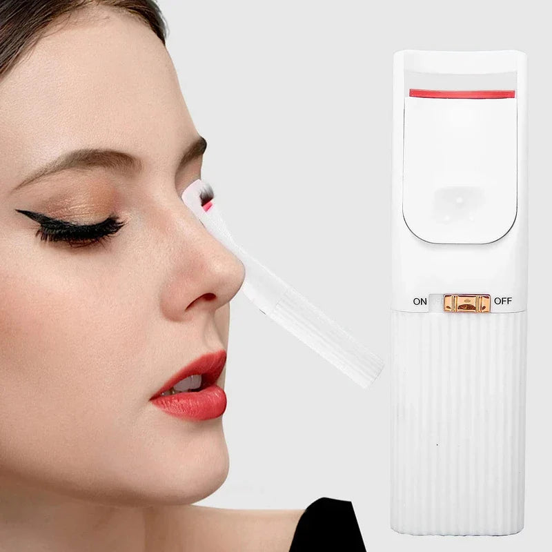 Heated eyelash curler in use