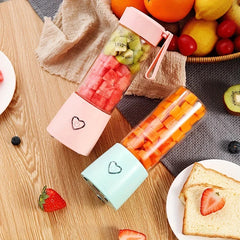 Portable juicer with orange slices and bottle