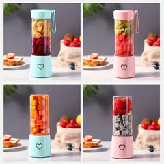 Portable Juicer - Four portable blenders in pink and mint green, each filled with different cut fruit, arranged in a 2x2 grid