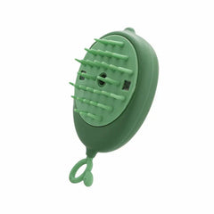 Uv Light Pet Grooming Comb - Angled view of green mango-shaped grooming brush with soft silicone bristles and hanging loop