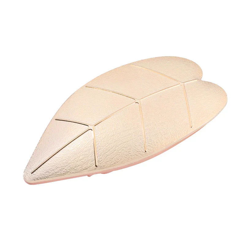 Uv Led Nail Lamp - Champagne gold leaf-shaped unit with embossed vein detailing, angled front view