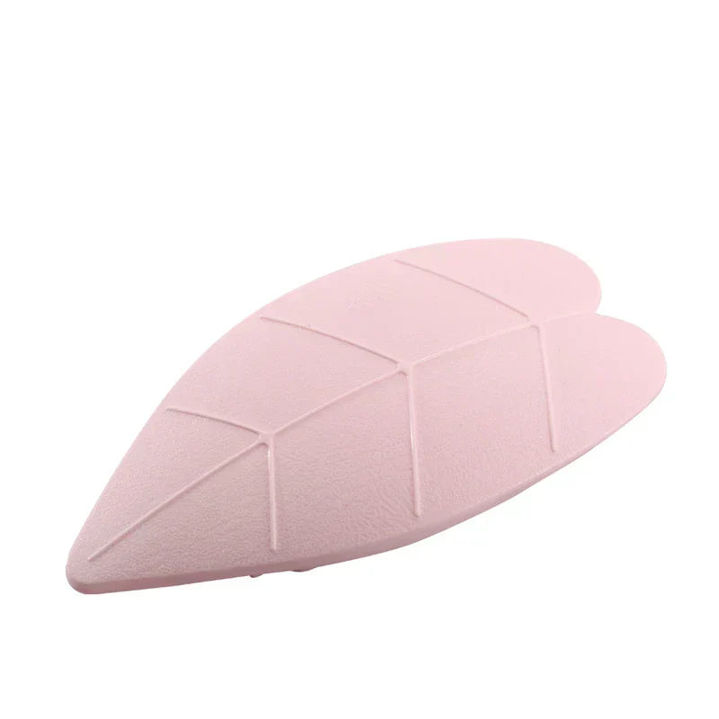 Uv Led Nail Lamp - Light pink leaf-shaped nail lamp viewed from a three-quarter angle against a white background