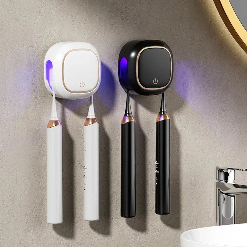 Uv Toothbrush Sanitizer Holder - Two units (white and black) mounted on textured bathroom wall holding electric toothbrushes with active UV light