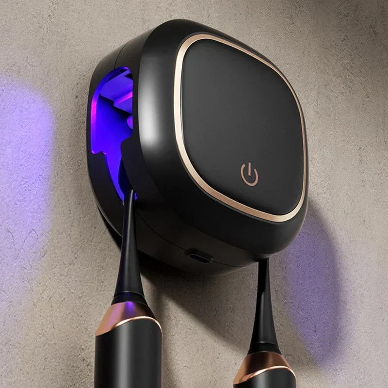 Uv Toothbrush Sanitizer Holder - Close-up of wall-mounted black UV toothbrush sanitizer holding two black electric toothbrushes, purple UV light visible