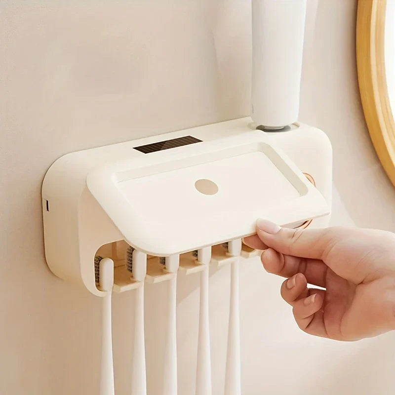 Uv Toothbrush Sterilizer - Hand lifting the protective dust cover of a wall-mounted toothbrush storage unit