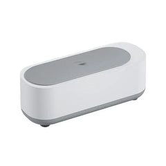 White and gray oval eyeglass cleaner machine with closed lid on a white background