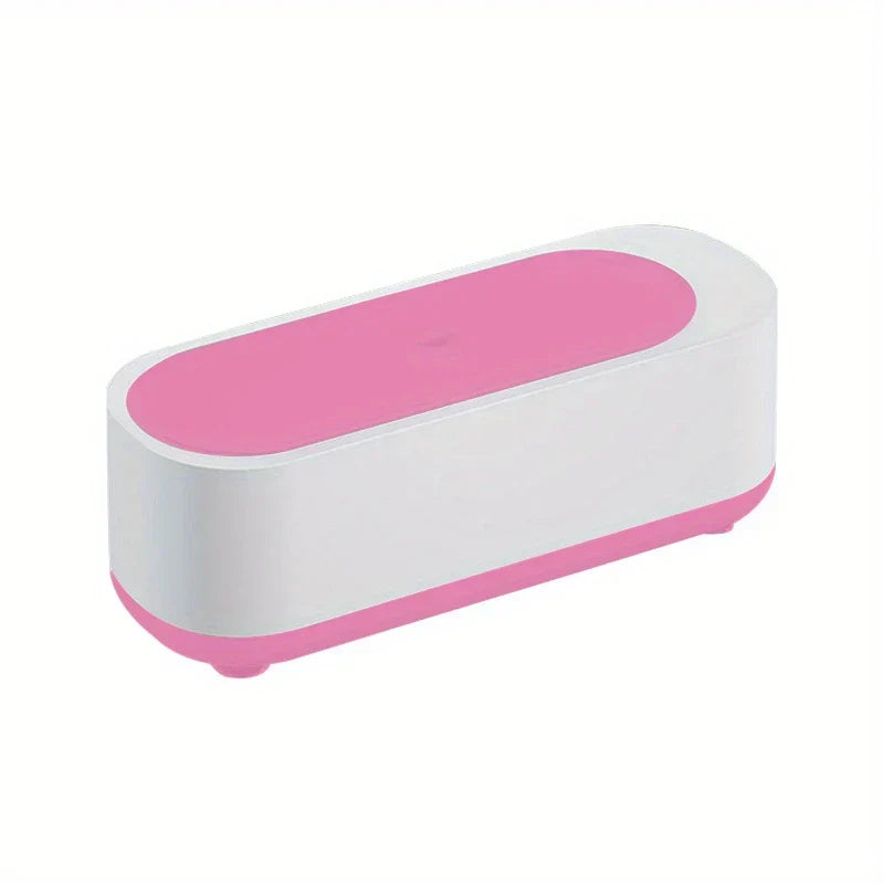 Pink and white oblong eyeglass cleaner machine on a white background