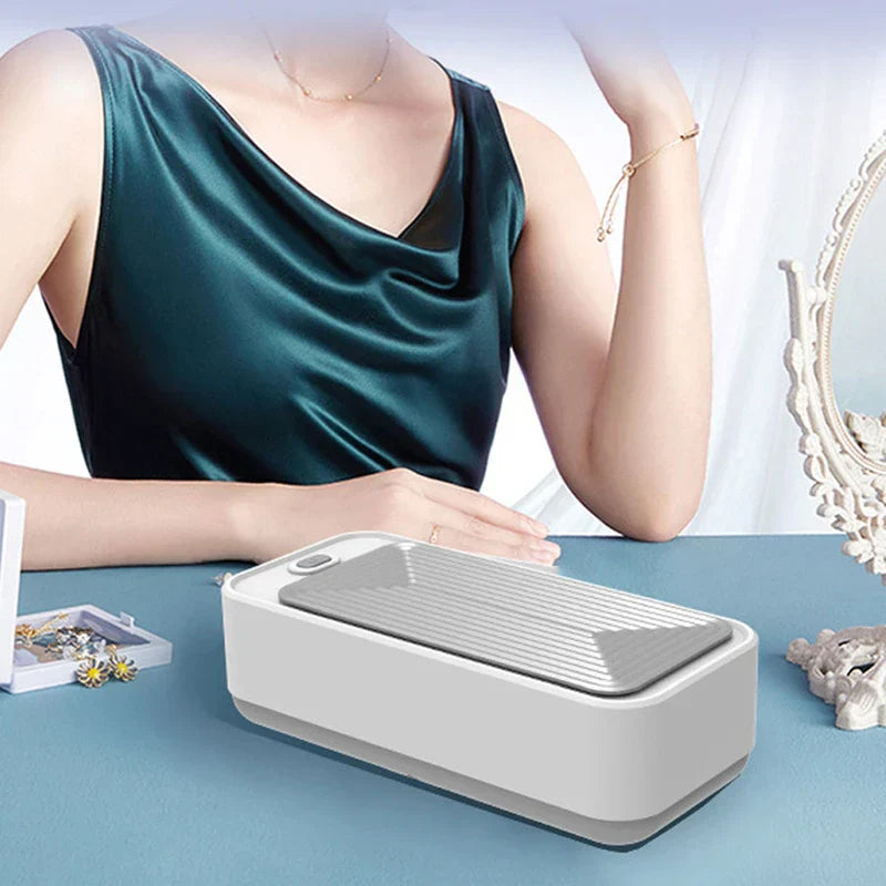 Compact ultrasonic glasses cleaner machine on a countertop