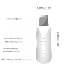 Skin Scrubber Spatula - Line drawing of ultrasonic skin scrubber labeling parts and size dimensions: 15.7cm tall, 5.5cm wide head