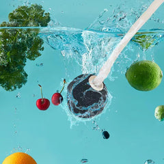 Ultrasonic Vegetable Fruit Washer - Underwater view of cleaning diffuser stone agitating water surrounded by fresh kale, cherries, lime, and orange