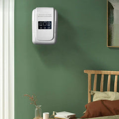 Ultrasonic Vegetable Fruit Washer - Wall-mounted white ozone generator on a dark green bedroom wall above a bedside table