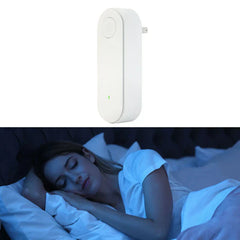 White plug-in ultrasonic pest repeller above photo of woman sleeping in bed