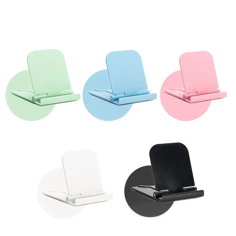 Adjustable desktop cell phone holder holding a smartphone