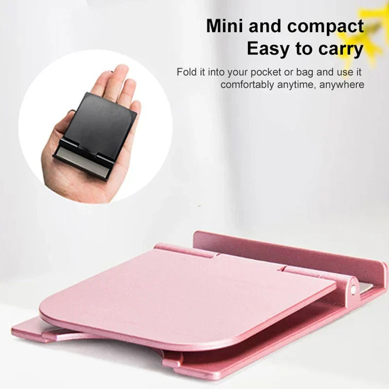 Cell Phone Holder - Folded and unfolded small pink device stand, with folded black stand held in a palm shown in a circular inset