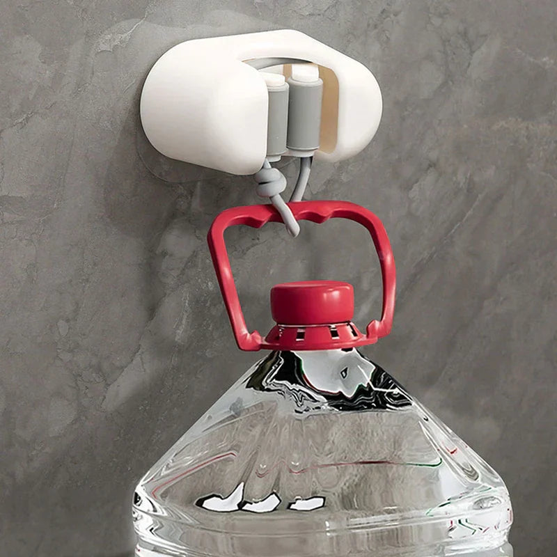 Utility Tool Storage Gripper Hanger System - White wall-mounted mop holder secured to a gray wall, holding a cord attached to a large clear plastic water jug