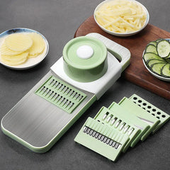 Mandoline - Slicer set with interchangeable cutting inserts and bowls of pre-cut potato and cucumber