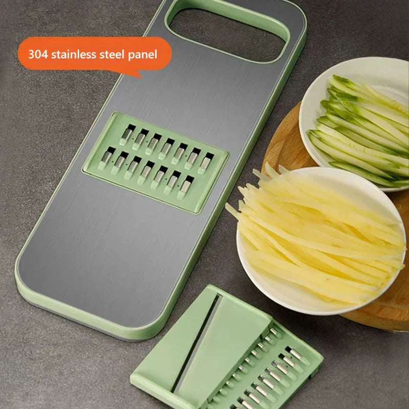 Mandoline - Vegetable slicer with 304 stainless steel panel, an interchangeable blade insert, and two bowls of sliced vegetables.