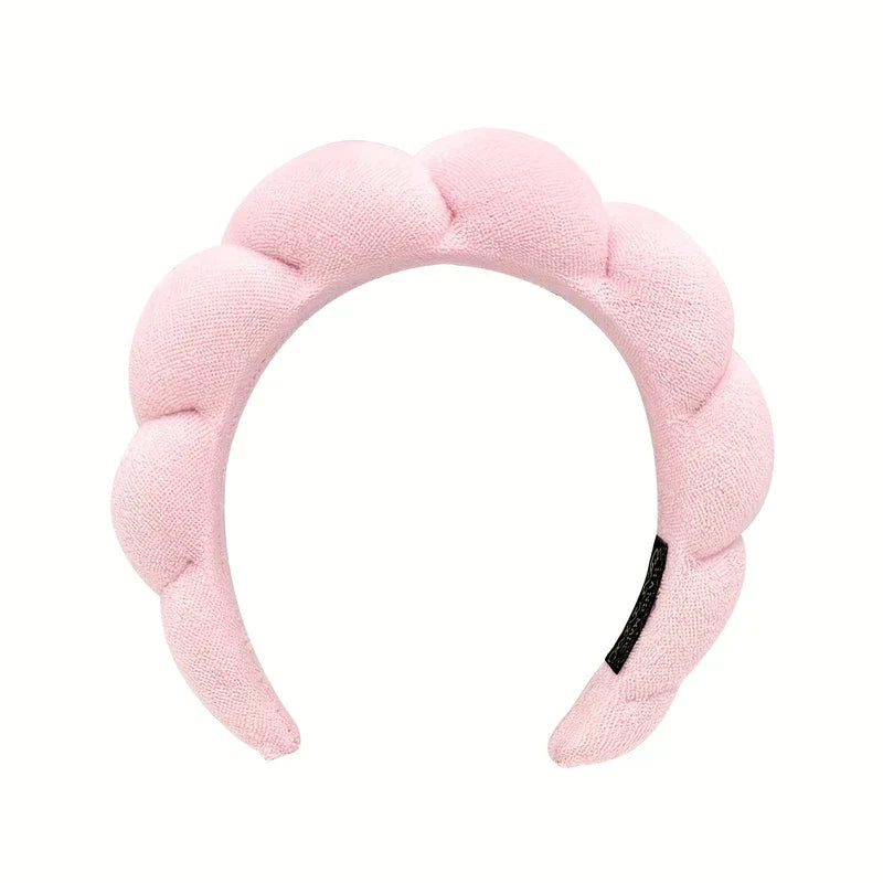 Close-up of a velvet padded sponge headband hair hoop on a table