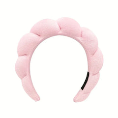 Close-up of a velvet padded sponge headband hair hoop on a table