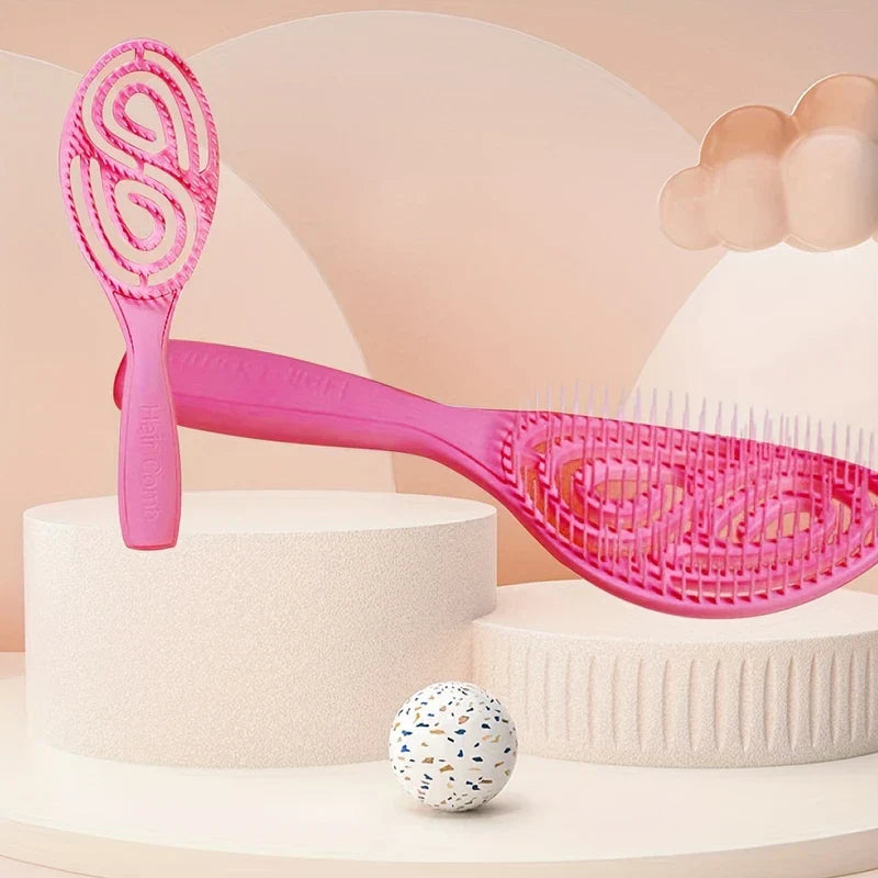 Paddle Hair Brush - Two pink vented hair brushes displayed on raised textured platforms with soft neutral decor