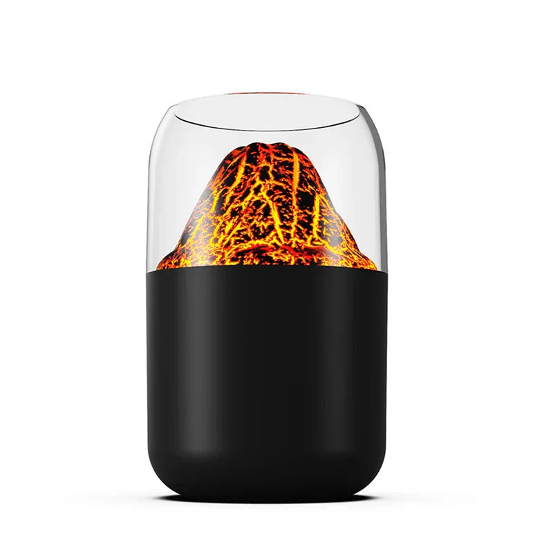 Aroma Diffuser Humidifier - Product unit with matte black base, clear upper enclosure, and lit lava-textured volcano insert against a plain white background