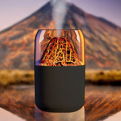 Aroma Diffuser Humidifier - Active unit emitting vertical mist, positioned on a reflective surface with a blurred real volcano landscape in the background