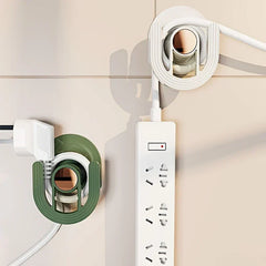 Slipper Rack Organizer - Two adhesive hooks (white and green) mounted on a tile wall holding electrical cords and a power strip