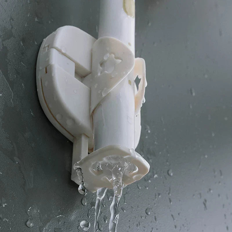 Electric Toothbrush Holder - White wall-mounted holder holding a white pole, mounted on a wet gray surface with water dripping from the holder.