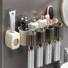 Toothbrush Holder Set - Cream wall-mounted bathroom organizer installed on a dark gray wall, holding toothpaste, a razor, two pump bottles, a hairbrush, and four electric toothbrushes with matching rinse cups