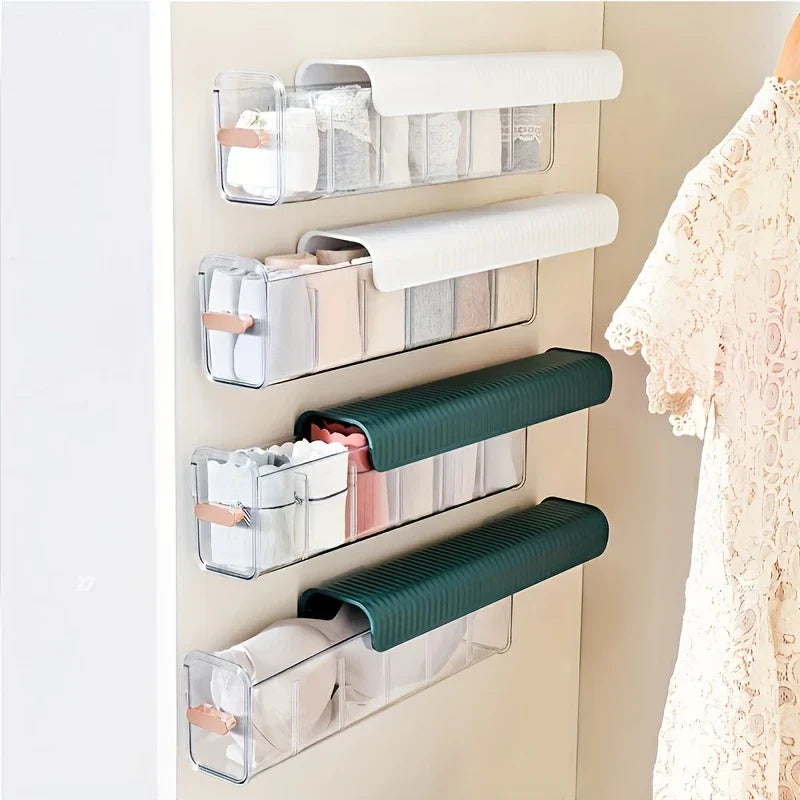 Sock Underwear Organizer Box - Four stacked installed storage units in white and dark green holding folded undergarments on a closet wall