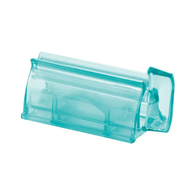 Wall Mount Toothpaste Dispenser - Translucent turquoise plastic tube squeezer shown alone against a plain white background