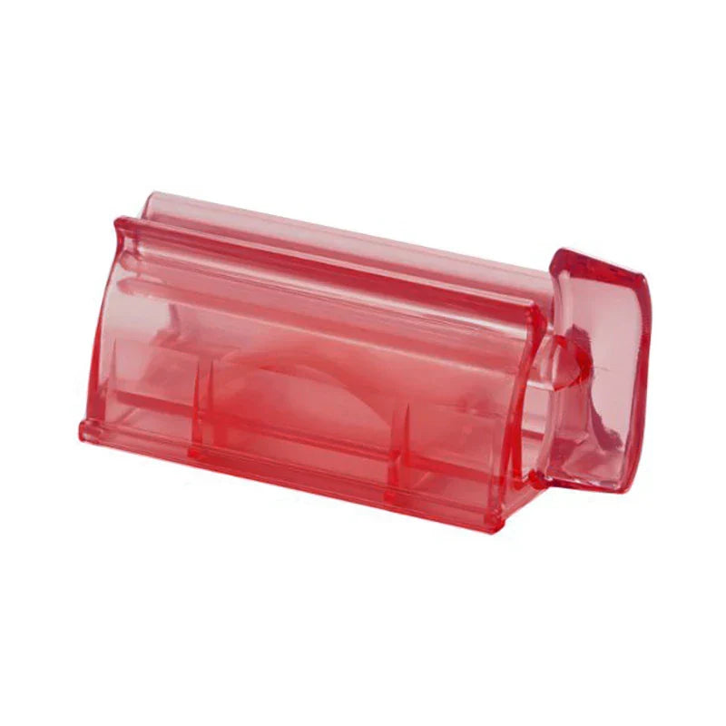 Wall Mount Toothpaste Dispenser - Translucent red plastic tube squeezer shown alone against a plain white background