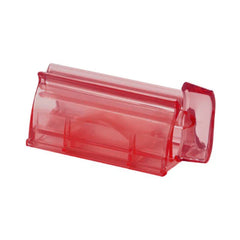 Wall Mount Toothpaste Dispenser - Translucent red plastic tube squeezer shown alone against a plain white background