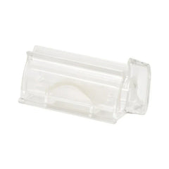 Wall Mount Toothpaste Dispenser - Clear transparent plastic hinged rectangular enclosure with a curved internal flap, displayed at an angle on a plain white background.