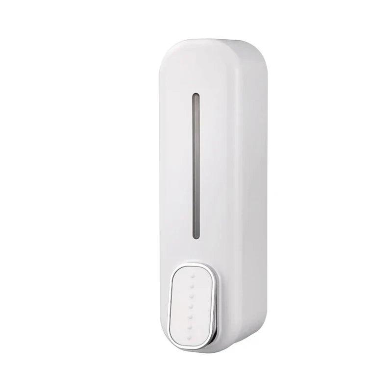 Plain white manual wall-mounted soap shampoo dispenser with a front liquid level window and push button, on a white background.