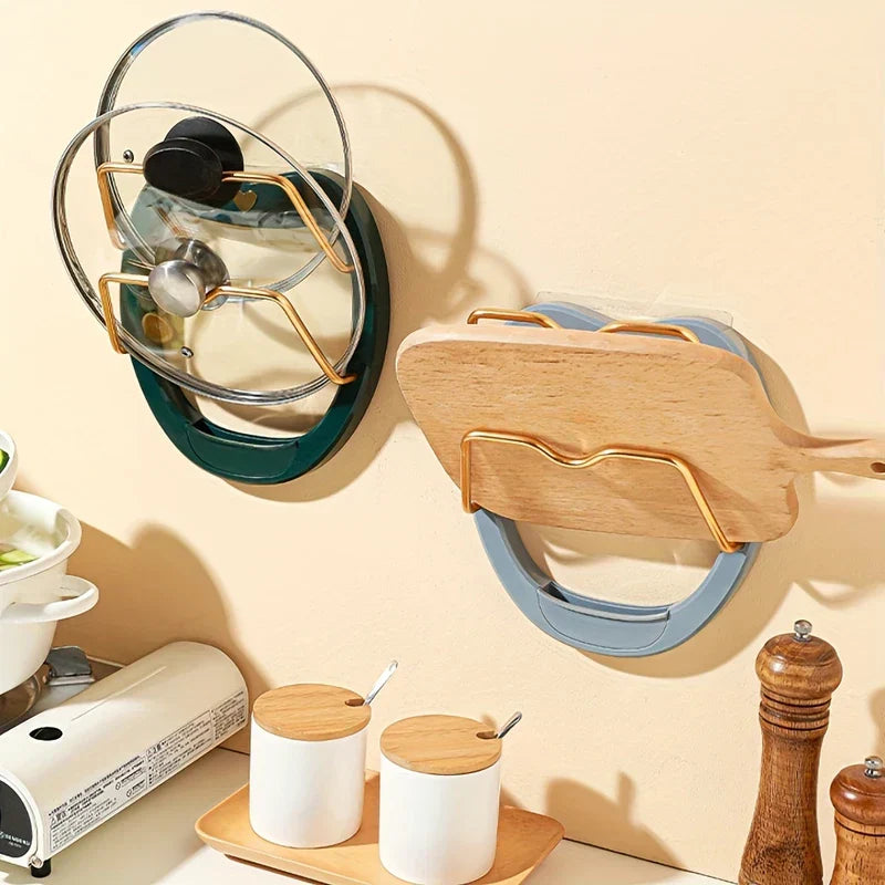 Wall Mounted Pot Lid Holder - Two installed organizers holding glass pot lids and a wooden cutting board on a kitchen wall