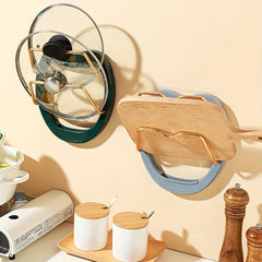 Wall Mounted Pot Lid Holder - Two installed organizers holding glass pot lids and a wooden cutting board on a kitchen wall