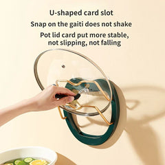 Wall Mounted Pot Lid Holder - Hand placing a glass pot lid into the dark green organizer, showing stable U-shaped slot design