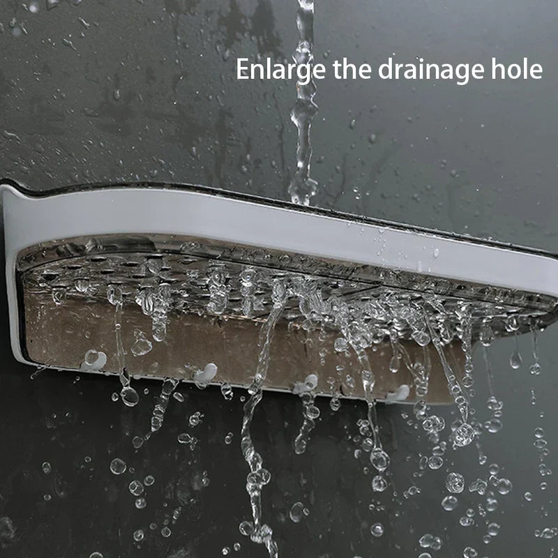 Wall Mounted Shelf - Shelf mounted against a dark wet surface with water draining through enlarged holes.