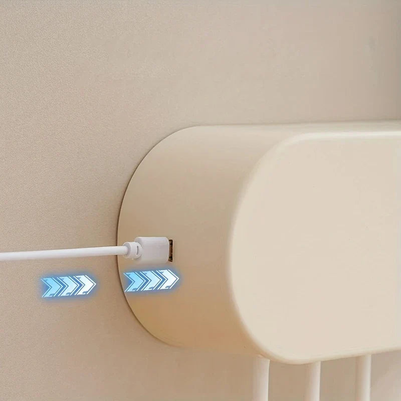Uv Toothbrush Sanitizer - Side view of the dispenser with a white USB charging cable plugged into its port