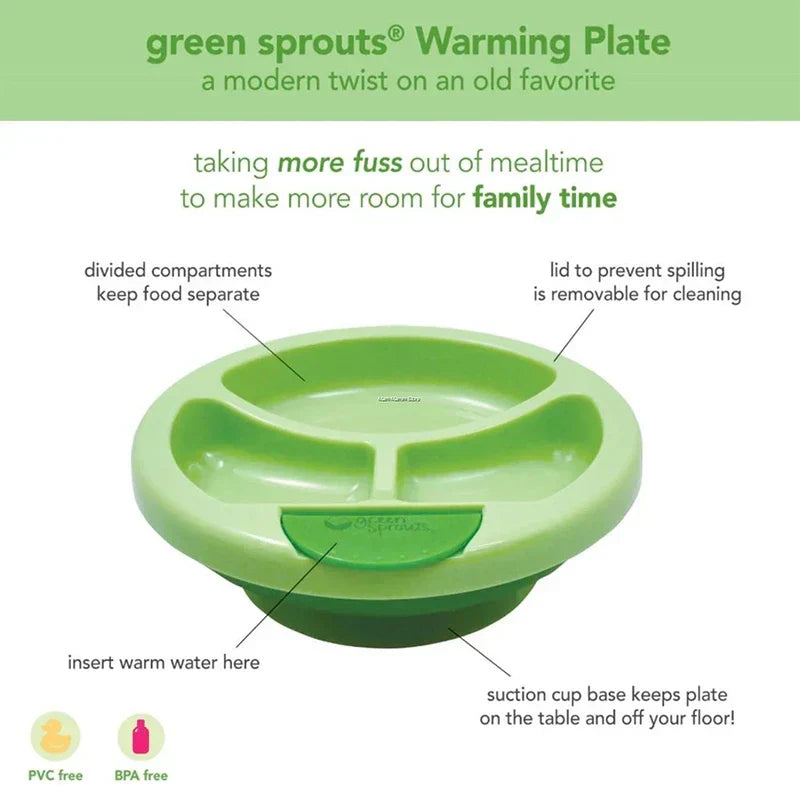 Food Warmer - Green baby warming plate with labels indicating features: divided compartments, lid, warm water insert, suction base, BPA/PVC-free.