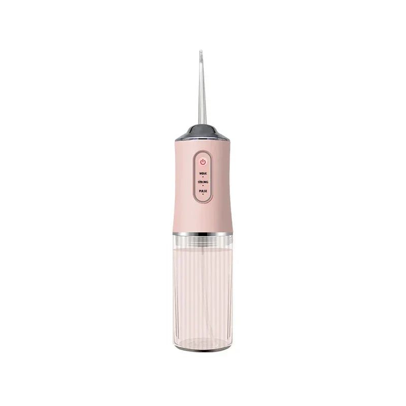 Water Flosser - Blush pink portable oral irrigator with clear ribbed water reservoir, three pressure setting controls, and extended floss tip