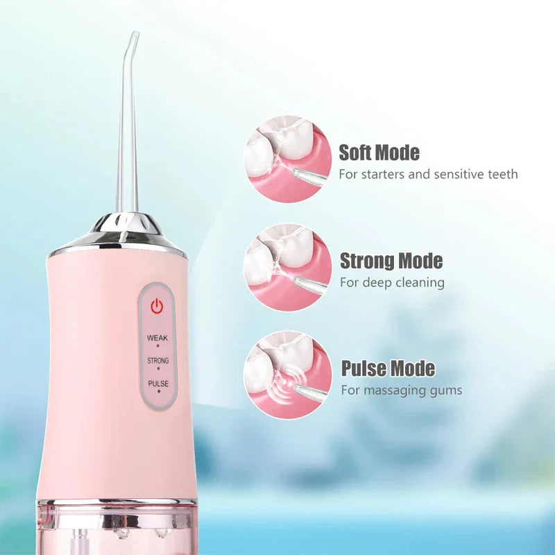 Close-up of pink portable water flosser with three mode descriptions and usage diagram callouts