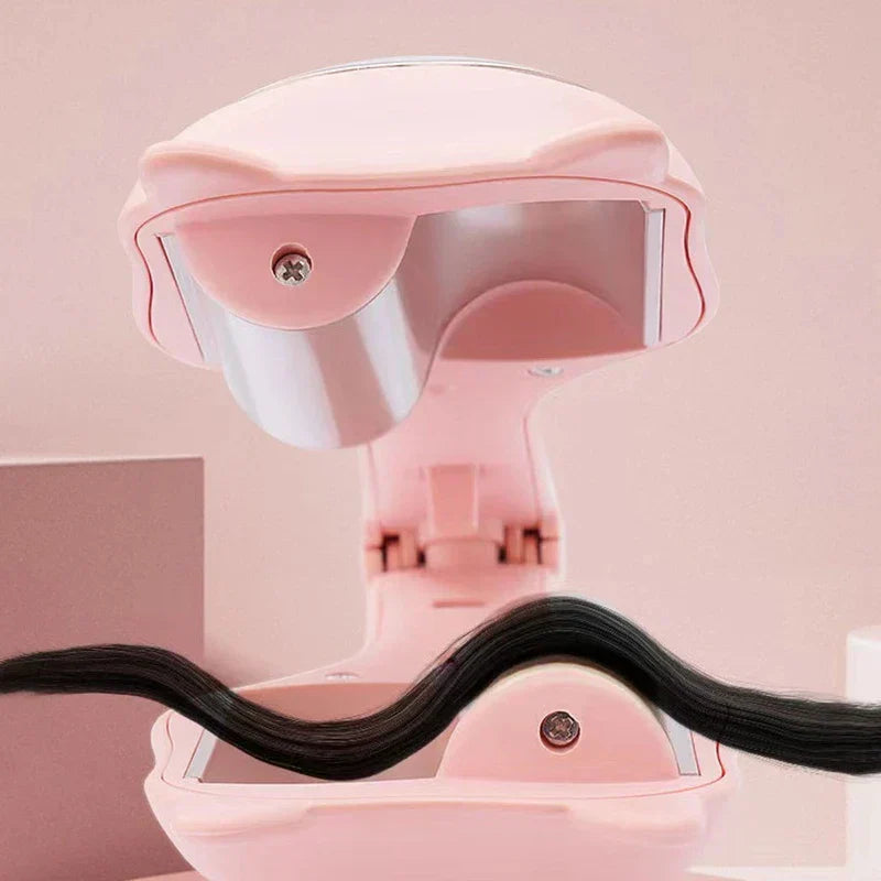 Open pink egg roll maker showing curved heating plates with a strand of black hair resting across them