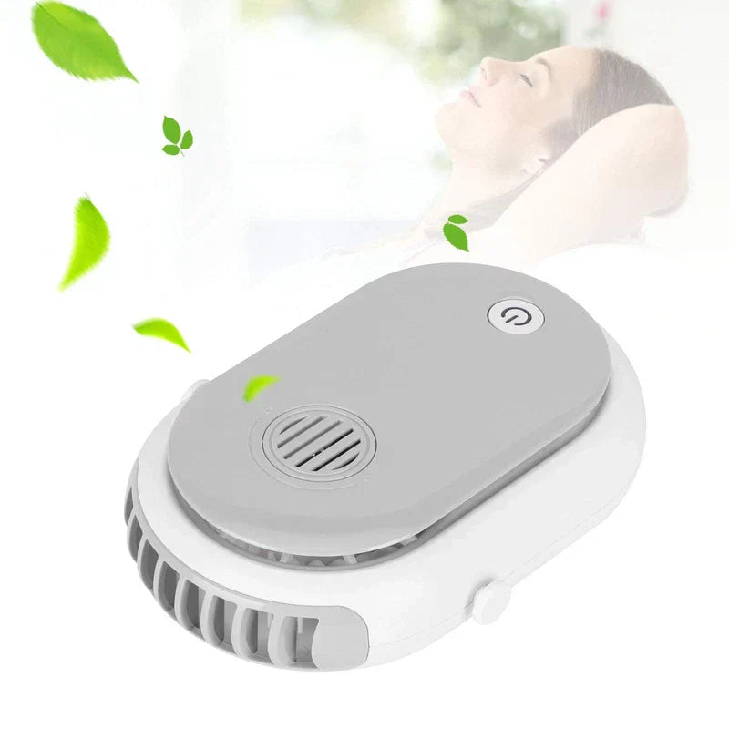 Bladeless Neck Fan - White and gray oval portable fan at an angle, with floating green leaves and a person relaxing in the background.