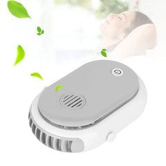 Bladeless Neck Fan - White and gray oval portable fan at an angle, with floating green leaves and a person relaxing in the background.