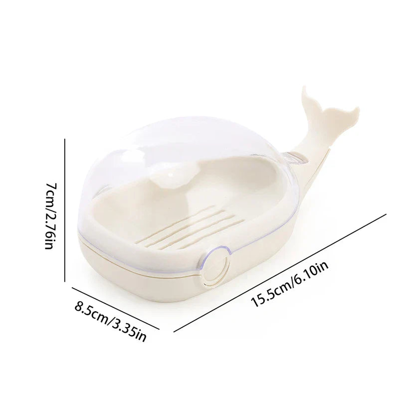 Cream whale-shaped soap dish with clear cover, showing dimension measurements on a white background